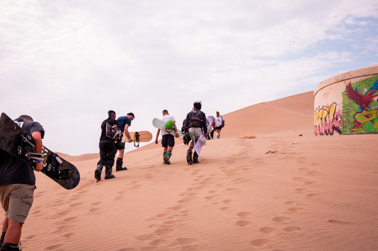 Sand boarding on Red Dunes near Dubai